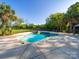 Inviting pool area with palm trees, a hot tub, and a fenced-in perimeter at 3677 Antioch Church Rd, Matthews, NC 28104