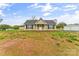 Charming single-story home featuring a classic design, manicured lawn, and a detached two-car garage at 391 Springs East Rd, Lincolnton, NC 28092