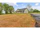 Well-maintained single-story home featuring a classic design, black shutters, and an expansive yard at 391 Springs East Rd, Lincolnton, NC 28092