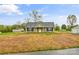 Inviting single-story home with a classic design, black shutters, and freshly manicured lawn at 391 Springs East Rd, Lincolnton, NC 28092