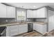 Well-lit kitchen featuring white cabinets, modern appliances, and granite countertops at 391 Springs East Rd, Lincolnton, NC 28092