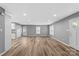 Bright, open-concept living area with modern wood flooring, neutral gray walls, and recessed lighting at 391 Springs East Rd, Lincolnton, NC 28092