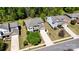 An aerial view showcases a home with a well-manicured lawn and long driveway at 4032 Wild Turkey Ln, Indian Land, SC 29707