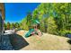 Lush backyard featuring a charming play set, perfect for Gathering fun and outdoor activities at 4032 Wild Turkey Ln, Indian Land, SC 29707