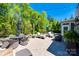Backyard patio with outdoor dining area, seating, built-in grilling area and play set at 4032 Wild Turkey Ln, Indian Land, SC 29707