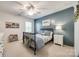 This charming bedroom features wood accent wall, ceiling fan, and a large window with plantation shutters at 4032 Wild Turkey Ln, Indian Land, SC 29707