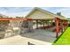 Outdoor grilling area with stainless steel appliances and covered seating area for community residents at 4032 Wild Turkey Ln, Indian Land, SC 29707