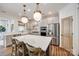 Well-lit kitchen with stainless steel appliances, central island with barstool seating at 4032 Wild Turkey Ln, Indian Land, SC 29707