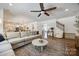 Bright living room with hardwood floors, plush sofa, and inviting atmosphere at 4032 Wild Turkey Ln, Indian Land, SC 29707