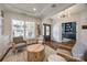 Cozy sitting area with hardwood floors, a large window and shutters, and decorative built-ins at 4032 Wild Turkey Ln, Indian Land, SC 29707