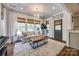 Bright and cozy living room space bathed in natural light with plush seating at 4032 Wild Turkey Ln, Indian Land, SC 29707