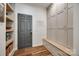 Well-organized mudroom with custom storage, a bench, and direct access to the entryway at 4032 Wild Turkey Ln, Indian Land, SC 29707