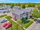 Aerial view of a townhome with lush landscaping, private parking, and nearby green spaces at 4133 Carl Parmer Dr, Harrisburg, NC 28075