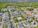 Expansive aerial of a planned community featuring various home styles, a pool, and green spaces near forested areas at 4133 Carl Parmer Dr, Harrisburg, NC 28075