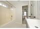 Bright bathroom featuring a white vanity, natural light, and a tiled shower at 4133 Carl Parmer Dr, Harrisburg, NC 28075