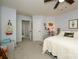 Bedroom featuring neutral carpet, a ceiling fan, and multiple doorways to other rooms at 4133 Carl Parmer Dr, Harrisburg, NC 28075