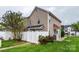 Two-story home features a white picket fence, manicured lawn, and neutral siding at 4133 Carl Parmer Dr, Harrisburg, NC 28075