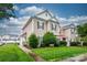 Charming townhome with well-maintained lawn and landscaping, showcasing curb appeal and inviting entrance at 4133 Carl Parmer Dr, Harrisburg, NC 28075