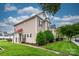 Townhome with manicured lawn, lush landscaping, and beautiful architecture at 4133 Carl Parmer Dr, Harrisburg, NC 28075