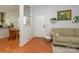 Inviting foyer with hardwood floors, neutral decor, and a view into the dining area and adjacent living space at 4133 Carl Parmer Dr, Harrisburg, NC 28075
