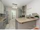 Modern kitchen showcasing granite countertops, stainless steel appliances, and tiled backsplash for a sleek, functional design at 4133 Carl Parmer Dr, Harrisburg, NC 28075