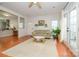 Comfortable living room showcasing hardwood floors, neutral decor, and seamless flow into dining and kitchen spaces at 4133 Carl Parmer Dr, Harrisburg, NC 28075