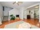 Upstairs living room showing hardwood floors and seamless flow into kitchen spaces at 4133 Carl Parmer Dr, Harrisburg, NC 28075