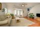 Bright living room featuring hardwood floors, neutral walls, and French doors to a patio, creating a welcoming atmosphere at 4133 Carl Parmer Dr, Harrisburg, NC 28075