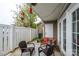 Charming patio area features outdoor seating, a wooden fence, and decorative hanging lights at 4133 Carl Parmer Dr, Harrisburg, NC 28075