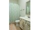 Bathroom with patterned shower curtain, tile floor and modern sink at 4205 Green Park Ct, Harrisburg, NC 28075
