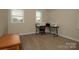 Bedroom featuring natural light from two windows and carpeted floor at 4205 Green Park Ct, Harrisburg, NC 28075