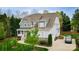 Beautiful two-story home featuring a well-manicured lawn, two car driveway, and lush landscaping at 4205 Green Park Ct, Harrisburg, NC 28075