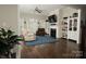 Comfortable living room with hardwood floors, fireplace, and white built-in shelving at 4205 Green Park Ct, Harrisburg, NC 28075