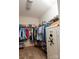 Large walk-in closet with ample shelving and storage space, including a safe for valuables at 4205 Green Park Ct, Harrisburg, NC 28075