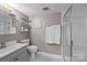 A well-kept bathroom provides the essentials, including a shower, toilet, sink, and mirror at 4754 Hedgemore Dr # O, Charlotte, NC 28209