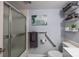 Bathroom with shower, grab bars, and updated fixtures and paint at 4754 Hedgemore Dr # O, Charlotte, NC 28209