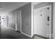View of a condo hallway featuring neutral walls and carpeting at 4754 Hedgemore Dr # O, Charlotte, NC 28209