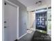 Hallway view of condo building's front entrance and stairwell access at 4754 Hedgemore Dr # O, Charlotte, NC 28209