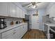 Well-lit kitchen with white cabinetry, stainless steel appliances, and modern countertops at 4754 Hedgemore Dr # O, Charlotte, NC 28209