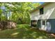 Backyard view shows a door leading into the basement and a fenced yard at 510 N Jackson Rd, Lancaster, SC 29720
