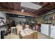 Unfinished basement with exposed wooden beams and ductwork offers ample storage and utility space at 510 N Jackson Rd, Lancaster, SC 29720