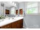 Well-lit bathroom with updated vanity, fixtures, and ample storage space at 510 N Jackson Rd, Lancaster, SC 29720