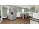 Spacious eat-in kitchen with stainless steel refrigerator and a table with seating for six at 510 N Jackson Rd, Lancaster, SC 29720