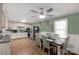 Eat-in kitchen with ample cabinets, a modern ceiling fan, and a dining area perfect for Gathering meals at 510 N Jackson Rd, Lancaster, SC 29720