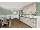 Charming kitchen with updated cabinets, appliances and a dining area perfect for Gathering meals at 510 N Jackson Rd, Lancaster, SC 29720
