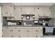 Detailed view of the eat-in kitchen's cabinets and countertops, showcasing the functional cooking space at 510 N Jackson Rd, Lancaster, SC 29720
