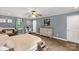 Spacious main bedroom featuring a cozy sitting area, natural light, and an ensuite bathroom at 510 N Jackson Rd, Lancaster, SC 29720