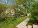 A lush backyard with garden and a shed in a well landscaped setting at 512 Secrest Ave, Belmont, NC 28012