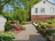 Landscaped backyard featuring custom garden beds and gravel pathway at 512 Secrest Ave, Belmont, NC 28012