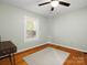Cozy bedroom with hardwood floors, a neutral rug, and a bright window offering natural light at 512 Secrest Ave, Belmont, NC 28012